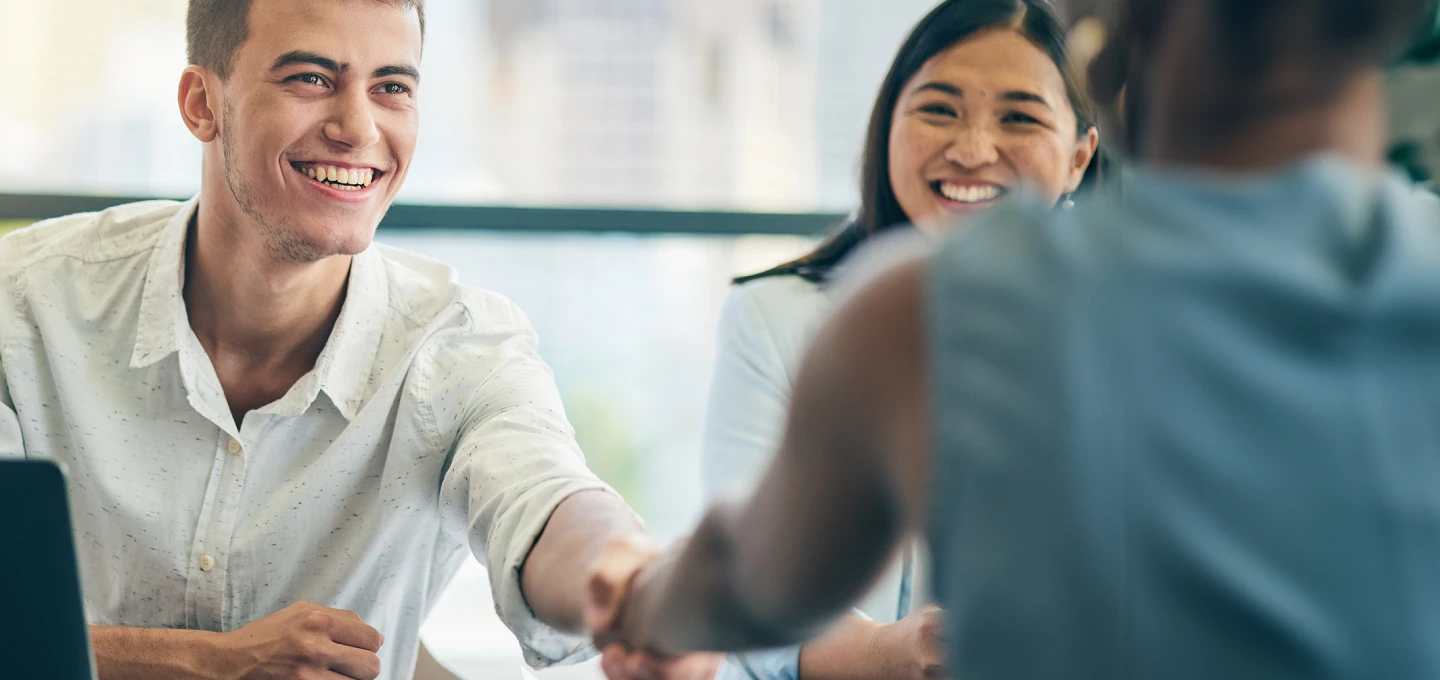 Two people with a deal done 